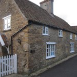 The roadside elevation showing the restored original windows which kept the character of the cottage in tact