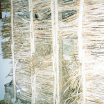 Original reed wall in front of stone chimney breast