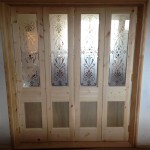 Versatile folding door room divider with bespoke etched glass