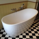 Free standing tub with wall mounted fittings